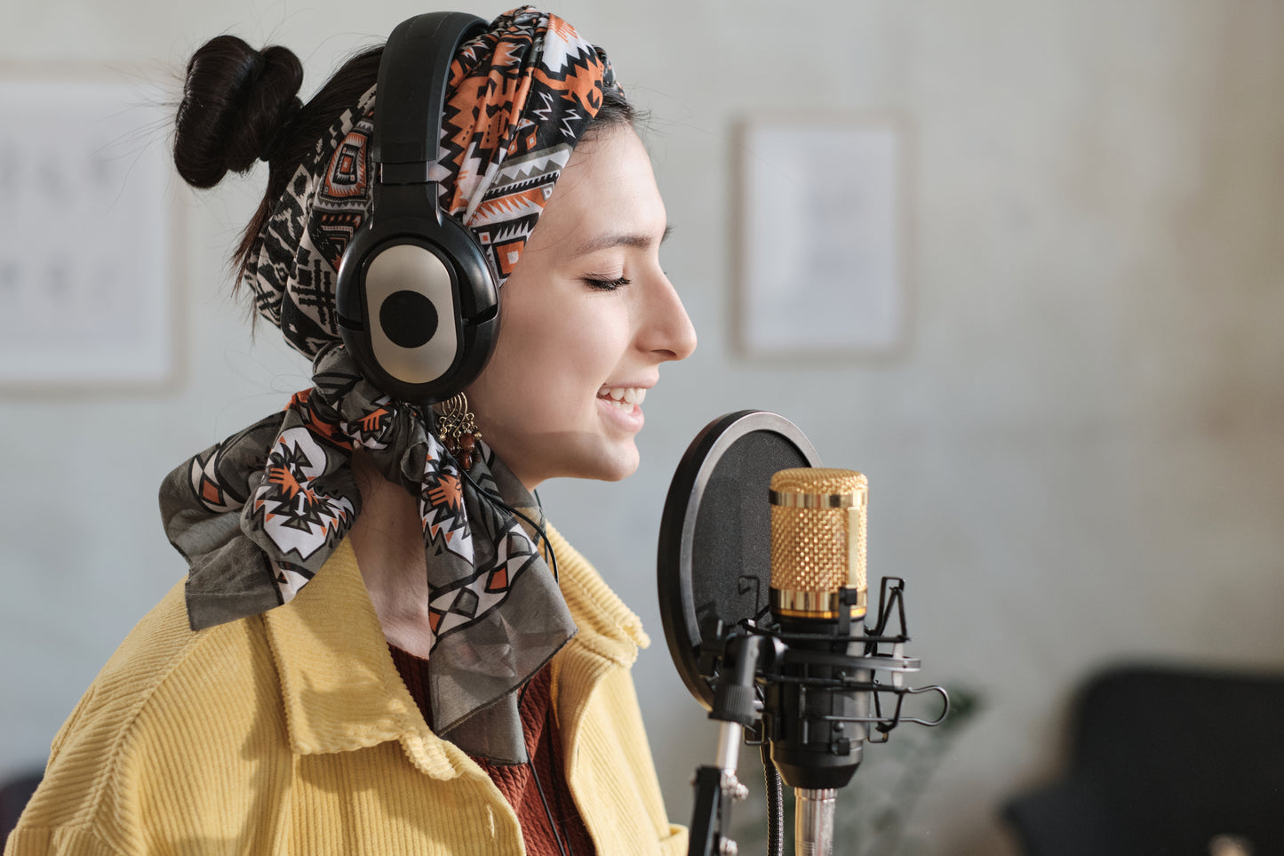 Woman listening to her voice in a singing lesson